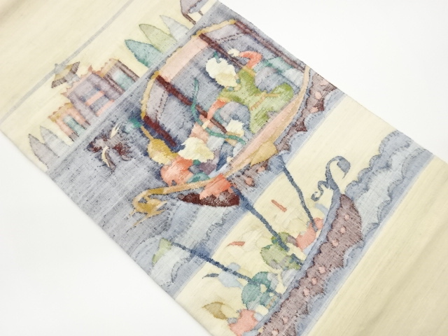 Handwoven tsumugi obi with woven abstract figure design on a ship